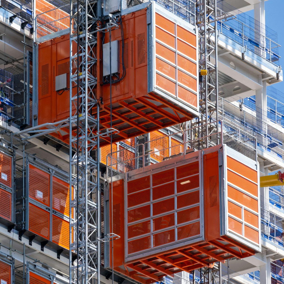 a very tall orange building with lots of windows
